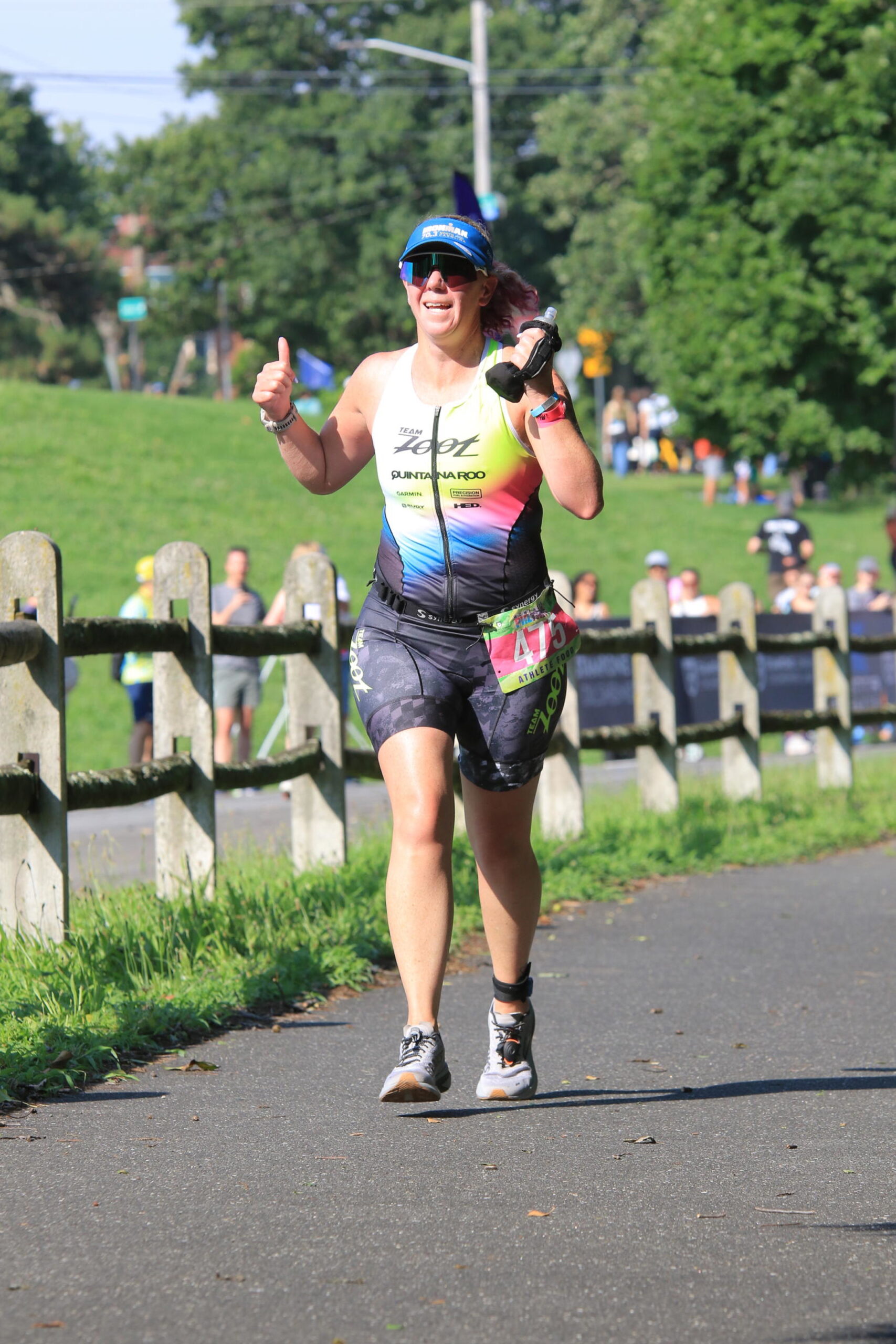 triathlon coach running in race